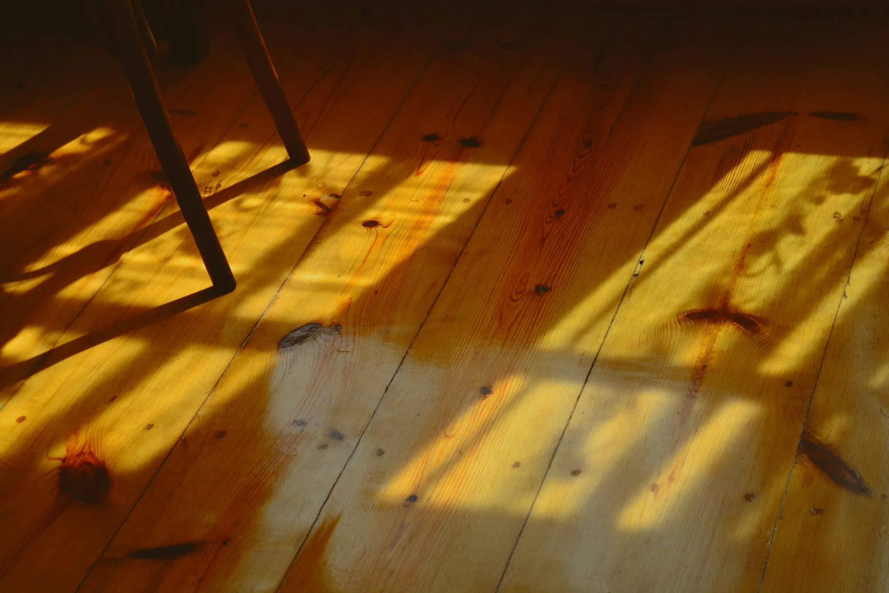 Sunlight falling through a window onto an oak floor